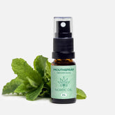 CBD- og myntearoma mundspray fra Nordic Oil med mynteblade i baggrunden