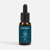Brun glasflaske med dropper og blå etiket med SLEEP DROPS og Nordic Oil-logo