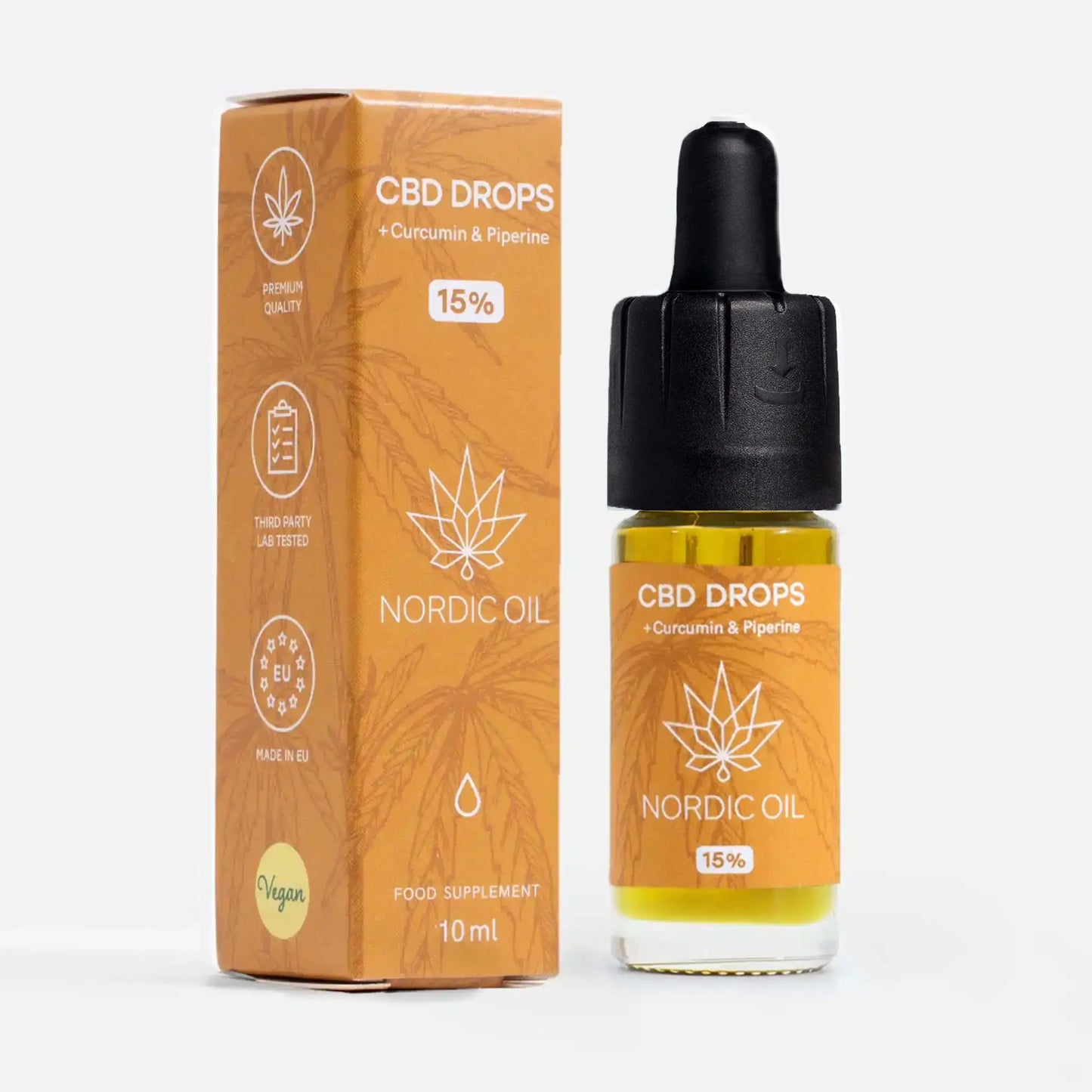 CBD-olie med curcumin (15%) Flaske med gurkemeje ved siden af emballagen